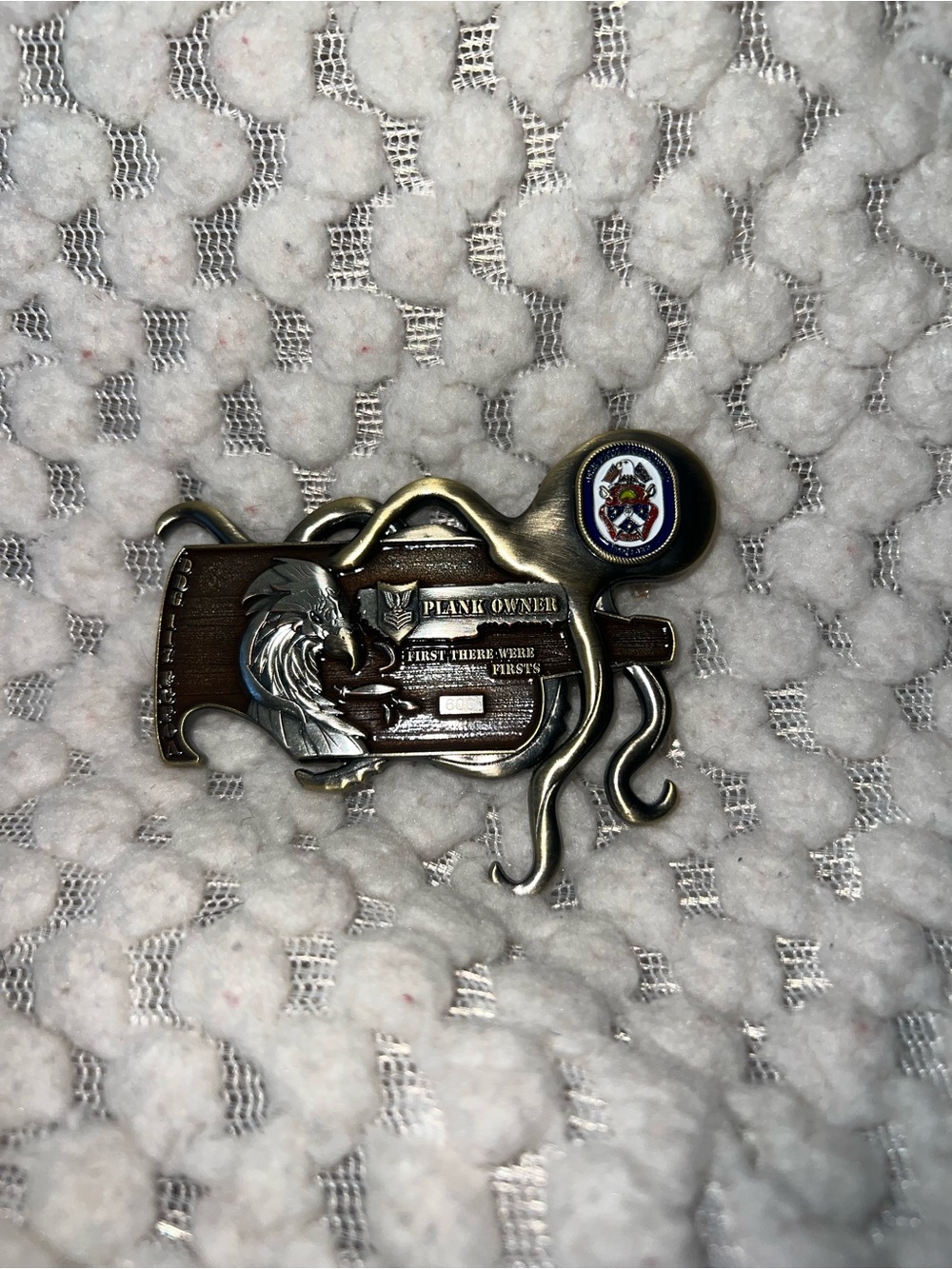 US Navy plank owner belt buckle featuring an octopus anchor design.